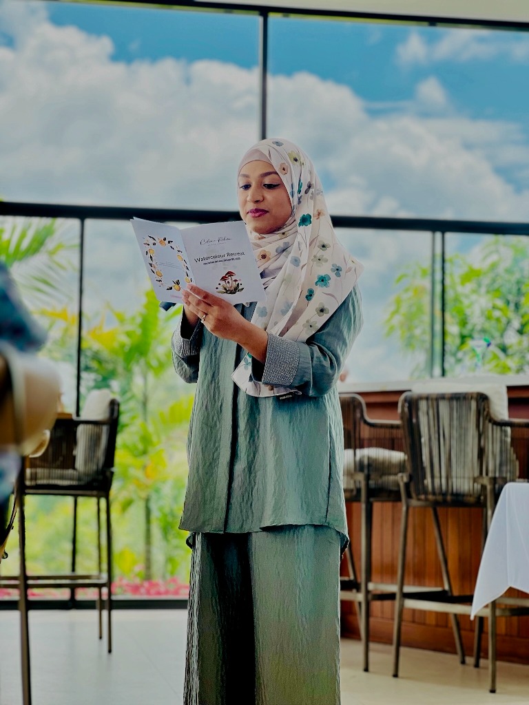 Celine Rahim hosting a loose contemporary watercolour retreat and presenting course brochures